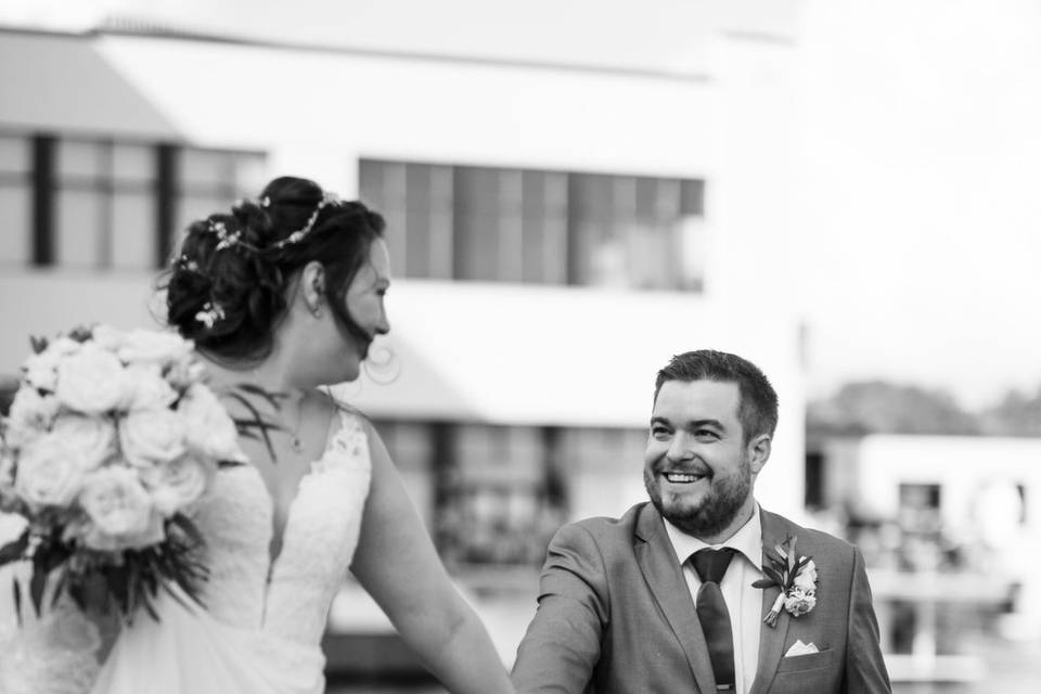 Bride and groom holding hands