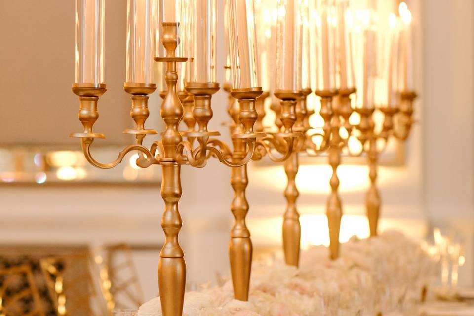 Gold candelabras with tapers