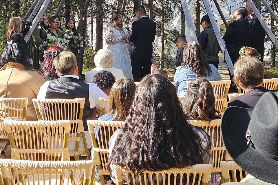 Ceremony under tipi poles