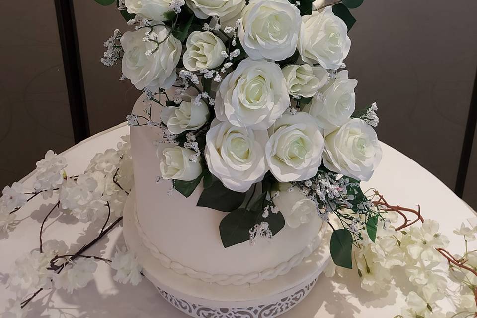 White wedding cake with roses