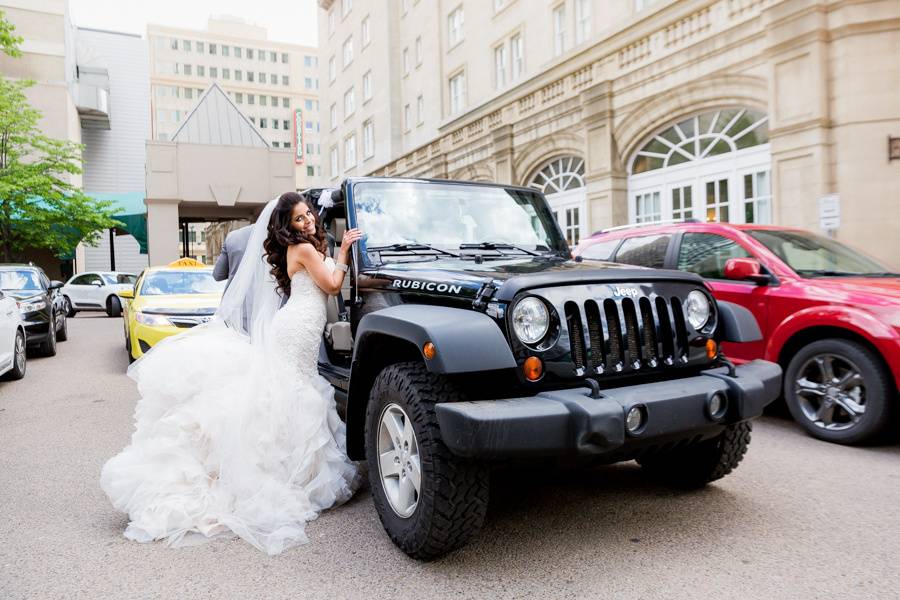 Bride with her hummer limo