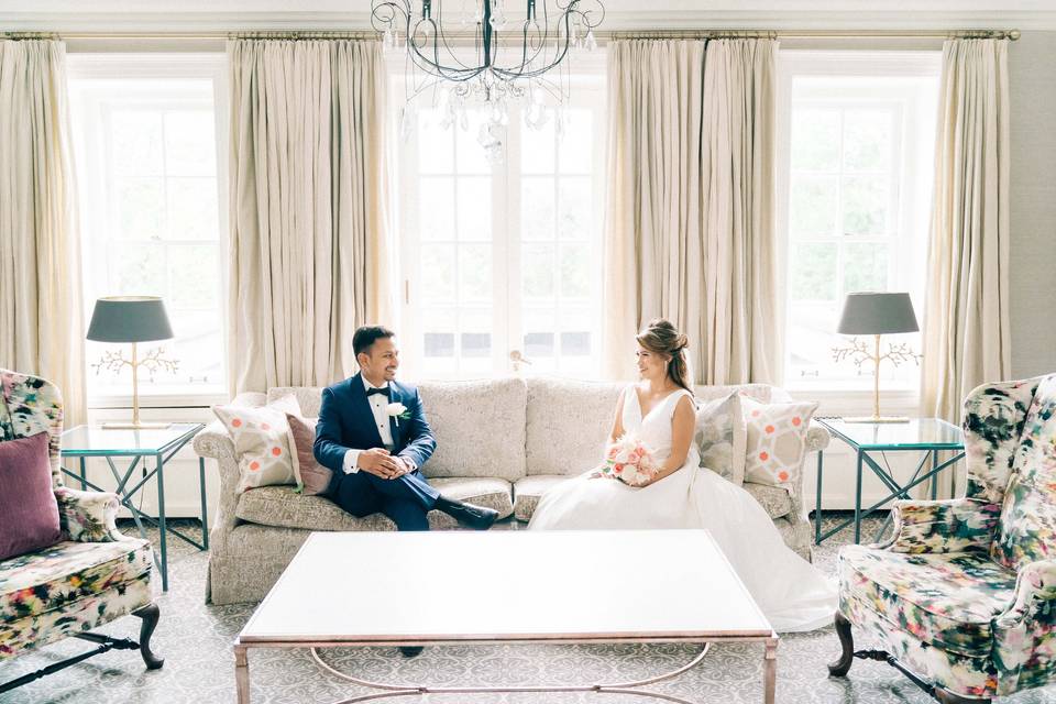 Bride & Groom sitting on sofa