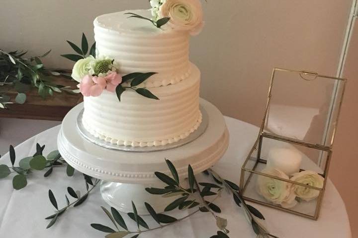 Two-tier cake with simple flowers