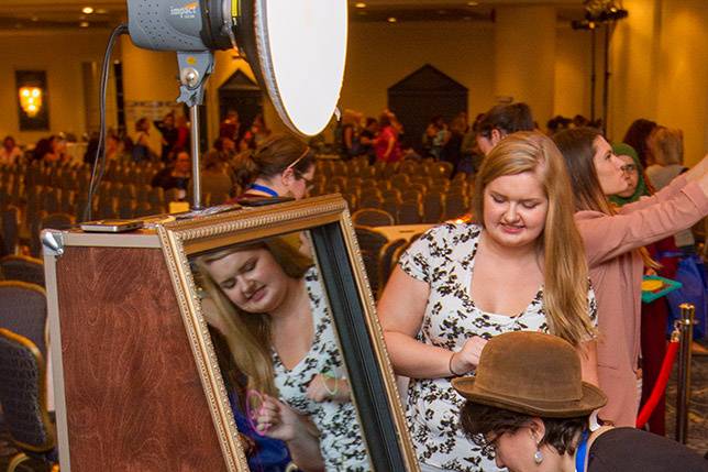 Guests signing their photos with the mirror booth