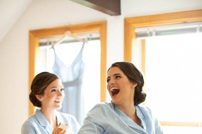 Sister helping bride...