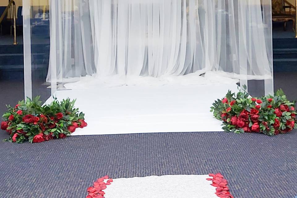 Red florals on our chuppah