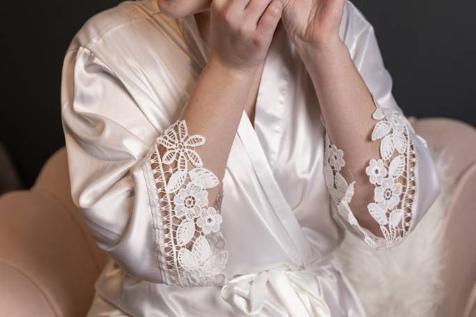 Bride putting her earrings on