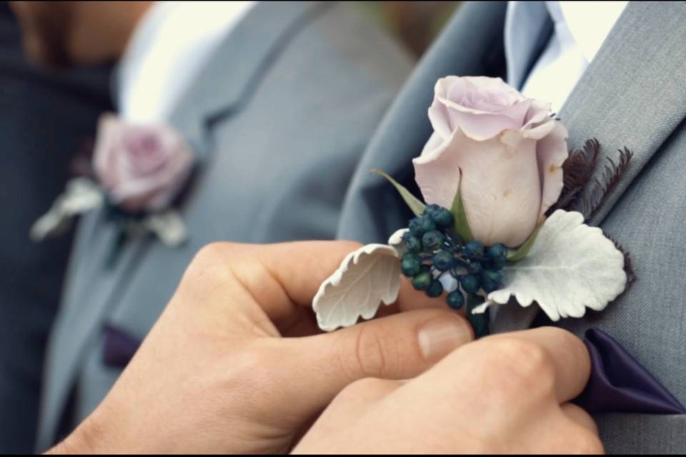 Pinning the boutonniere