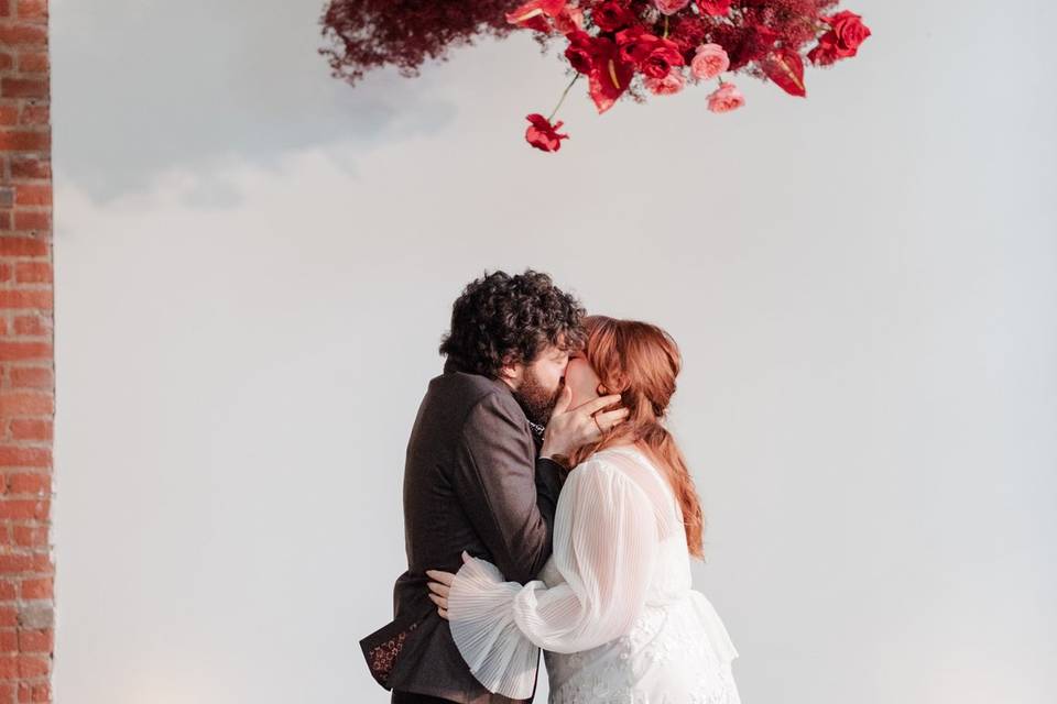 First kiss, florals, ceremomy