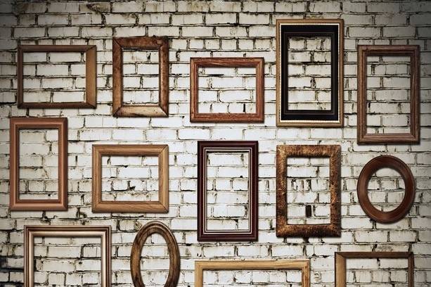 Frames on brick wall backdrop