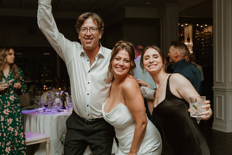 Bride sister and dad dancing