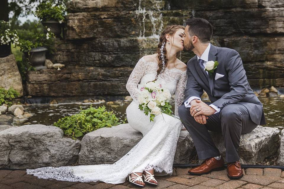 Kiss bride groom waterfall