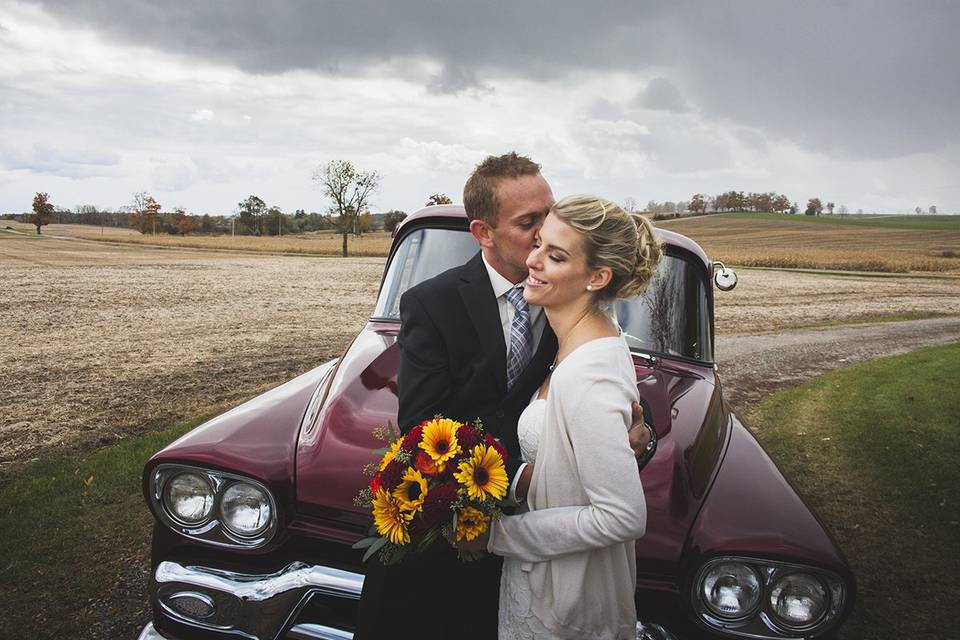 Bride groom truck sky field