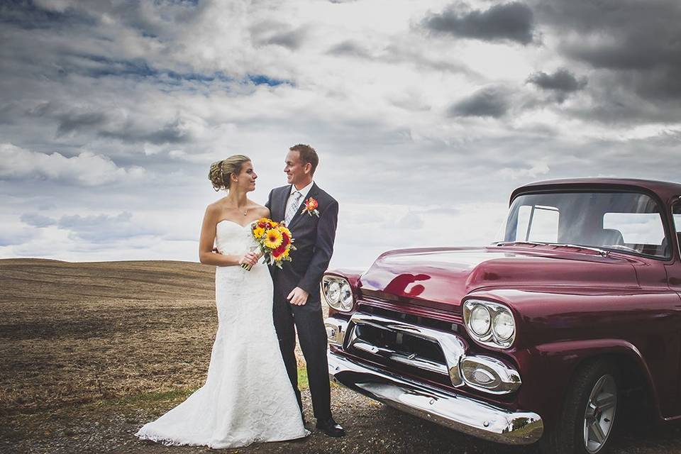 Bride groom truck sky field
