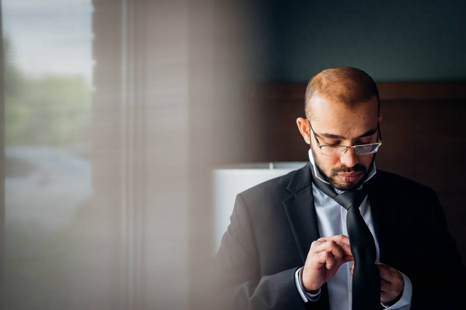 Putting on tie