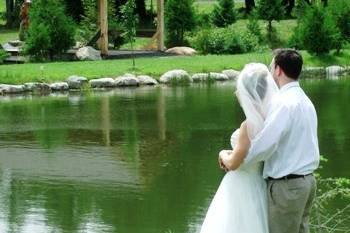 couple at pond looking at covered bridge.jpg