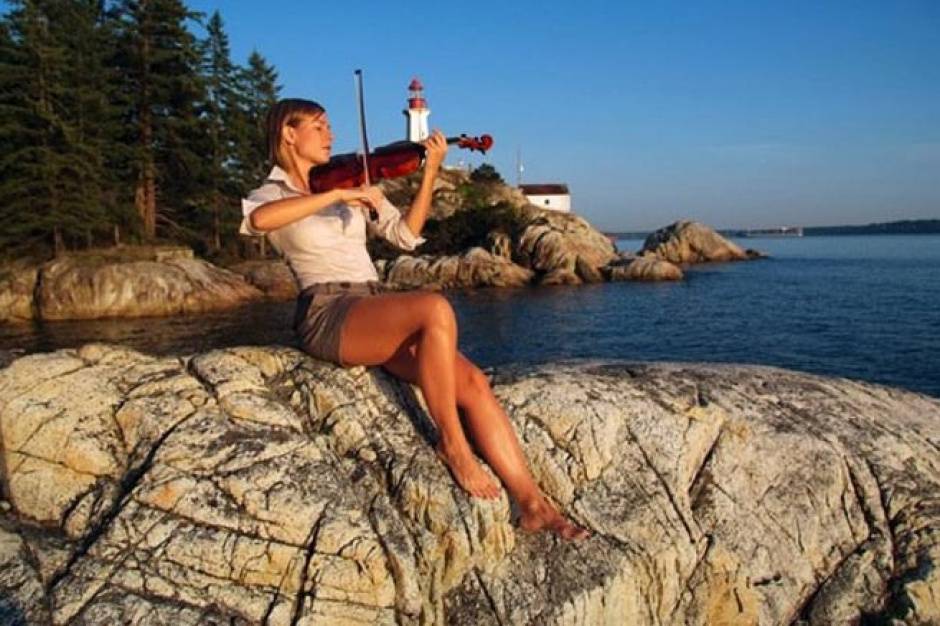 Violinist by lighthouse, BC