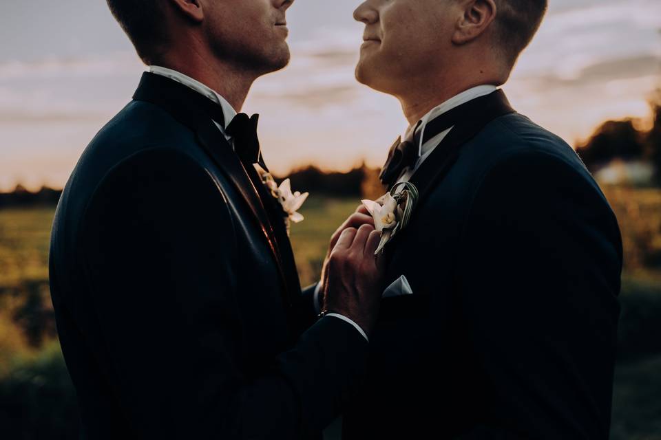 Two grooms and sunset