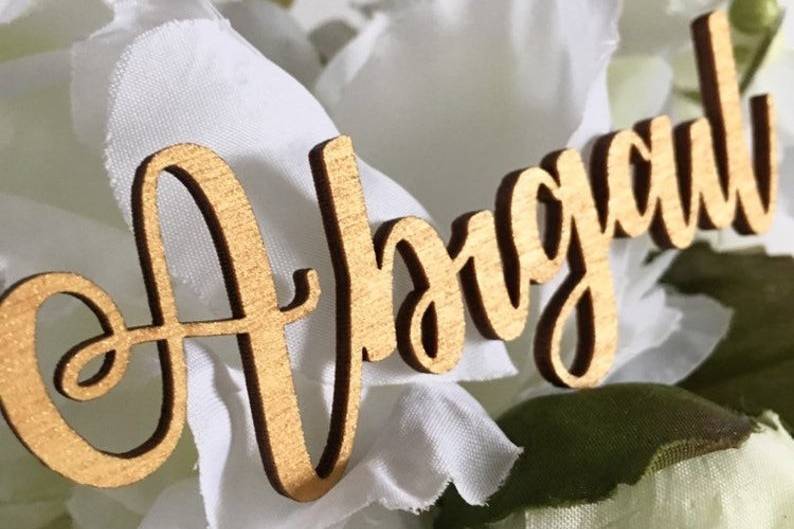 Gold painted laser cut names