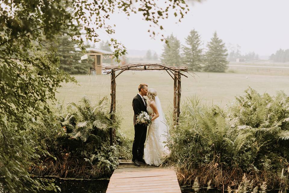 A Kiss Under a Forest Arch