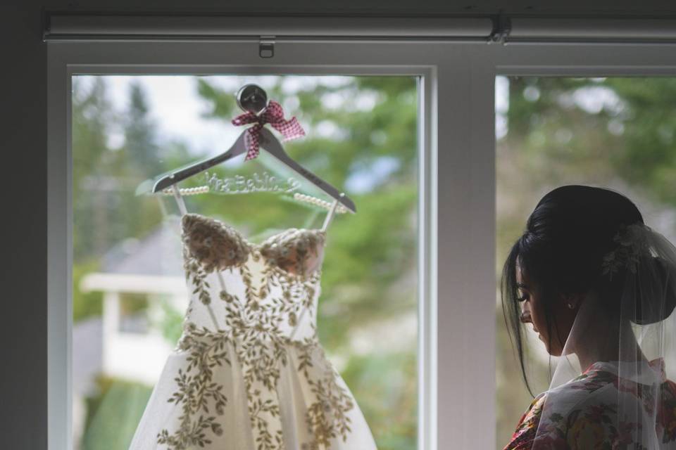 Bride admiring wedding dress