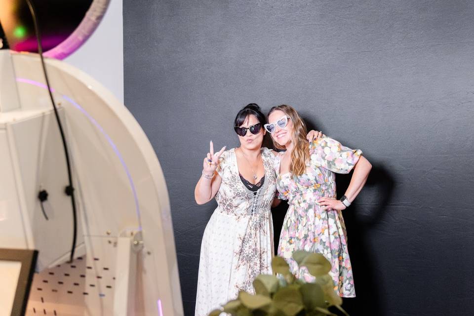 Guests posing w black backdrop