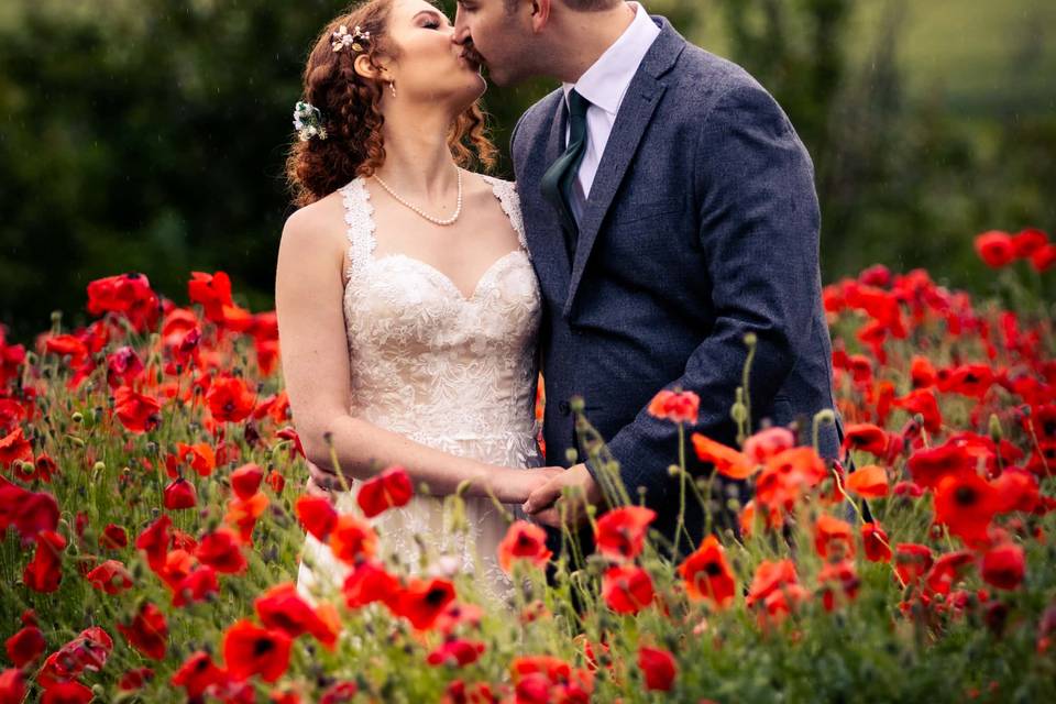 Kissing surrounded by flowers