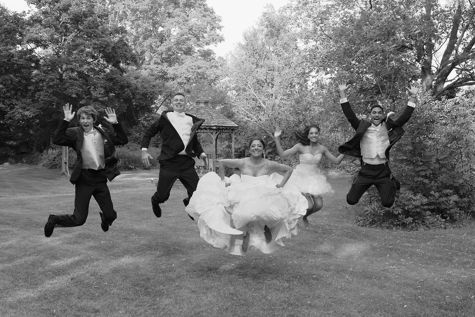 Happy bridal party jumping