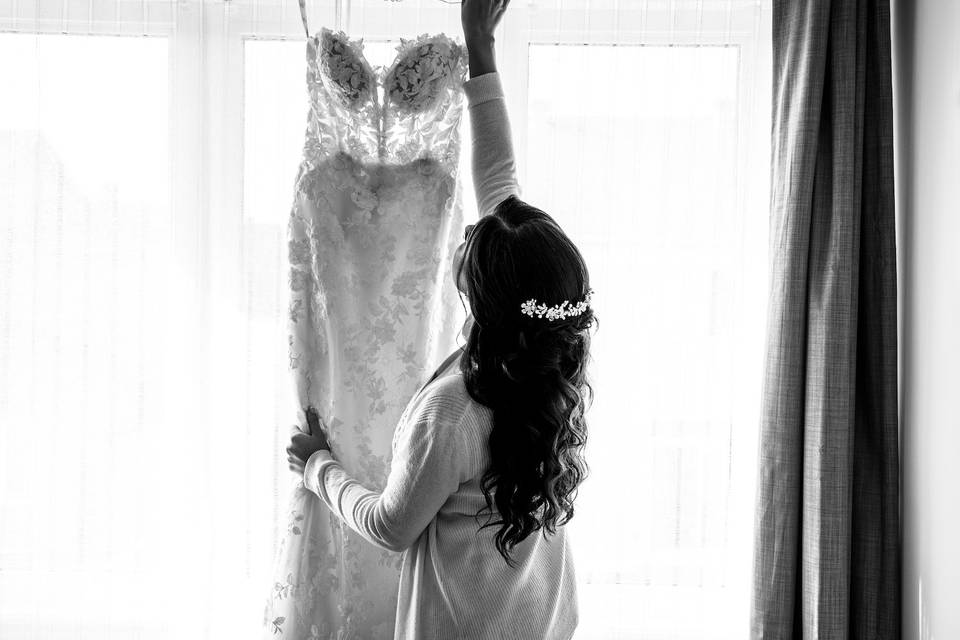 Bride taking dress