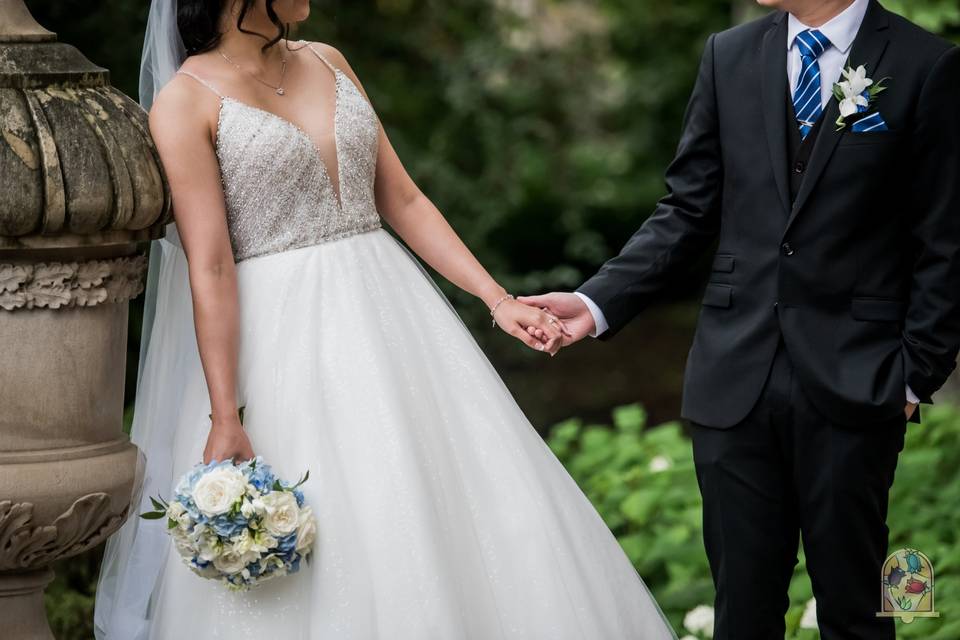 Bride and groom hand in hand