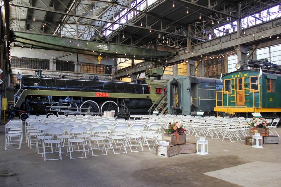 Ceremony with trains in the background