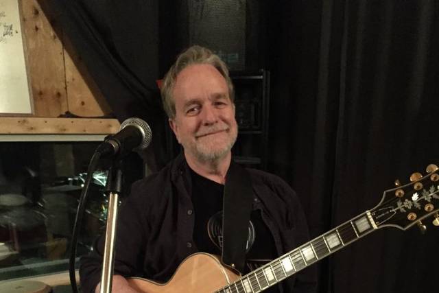 With guitar in the studio