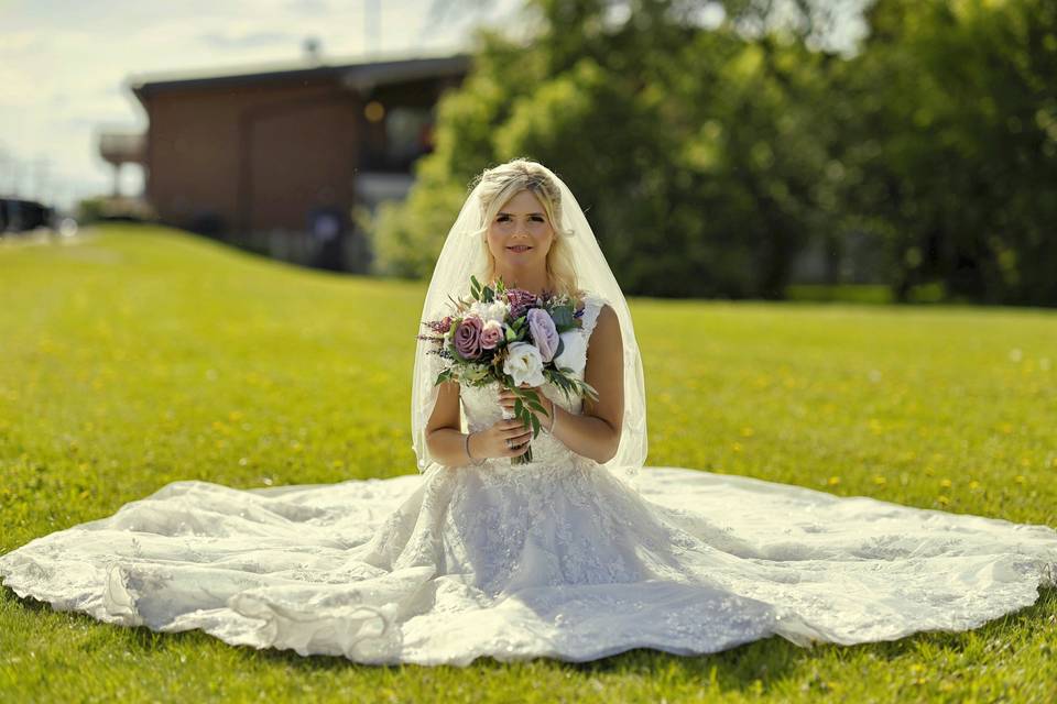 Bride Posting On Grass