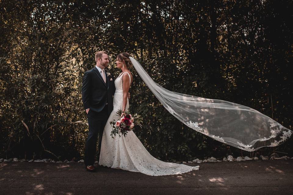 Bride & groom veil windy