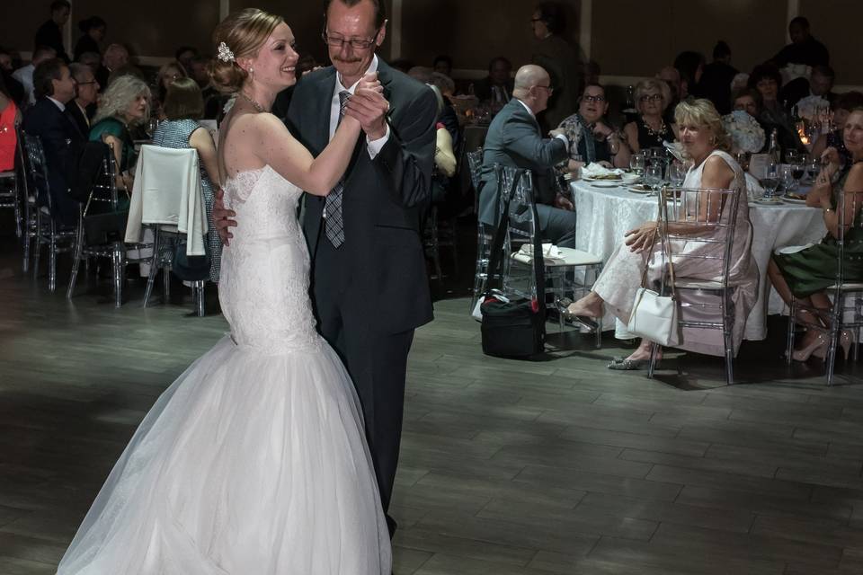 Bride dancing with father