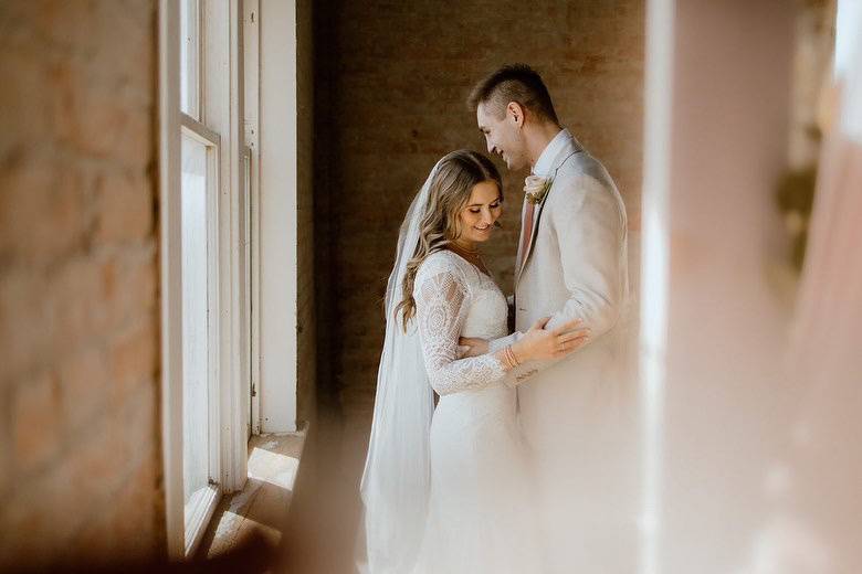 Couple holding each other - photographer: loveandbelovedphoto