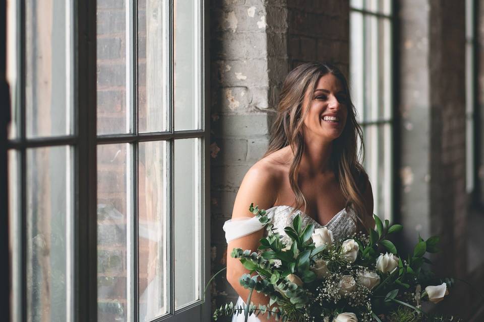 Beautiful bride by the window