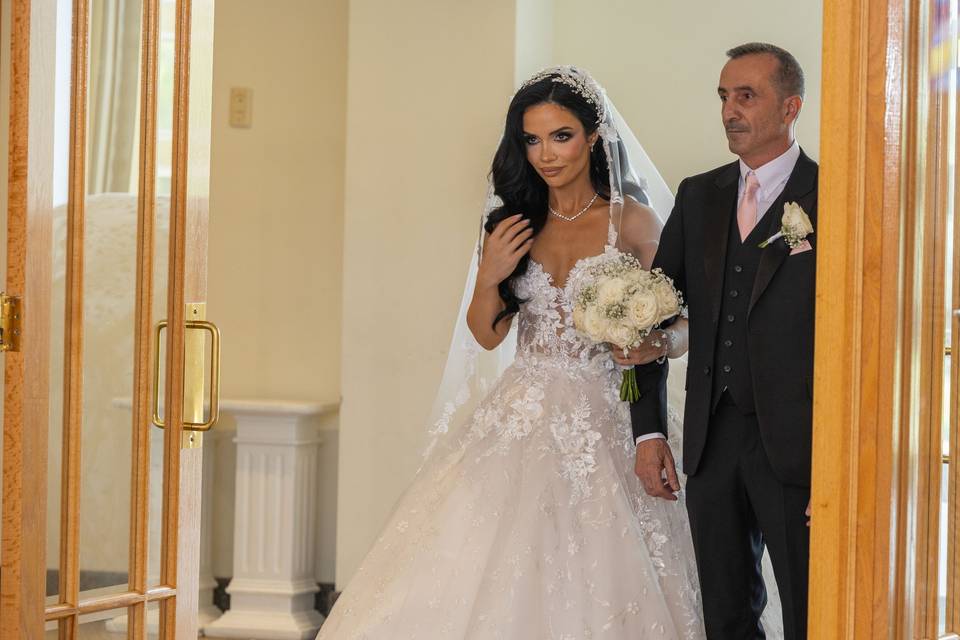 Bride walking with her father