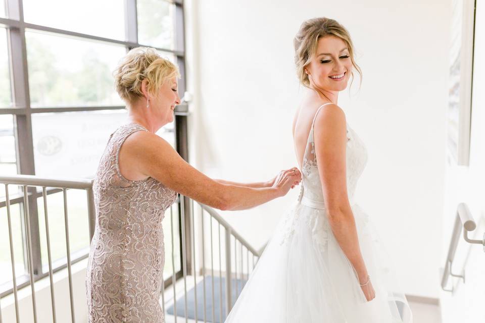 Mom helping with dress