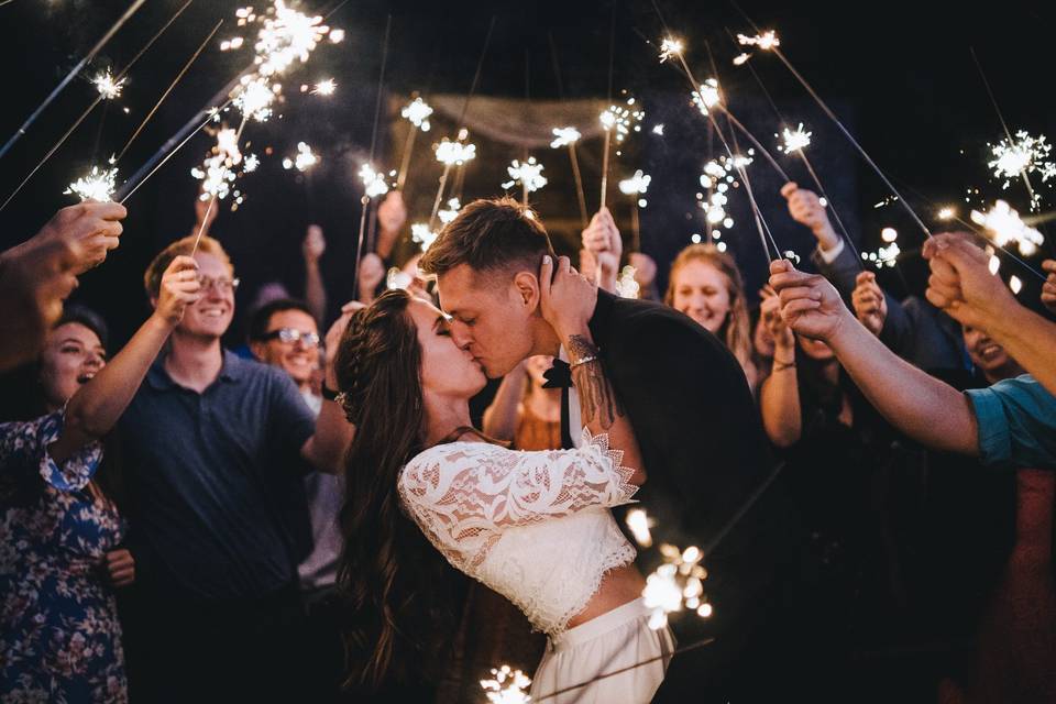 Newlyweds with sparklers