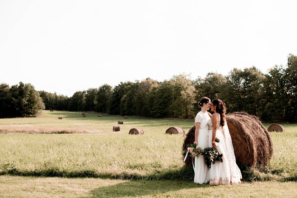 Two brides in an open field