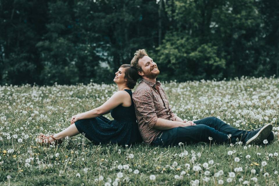 Couple on dandelion field