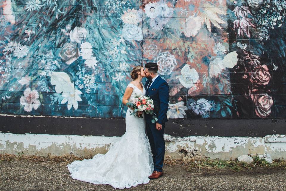Wedding couple by mural