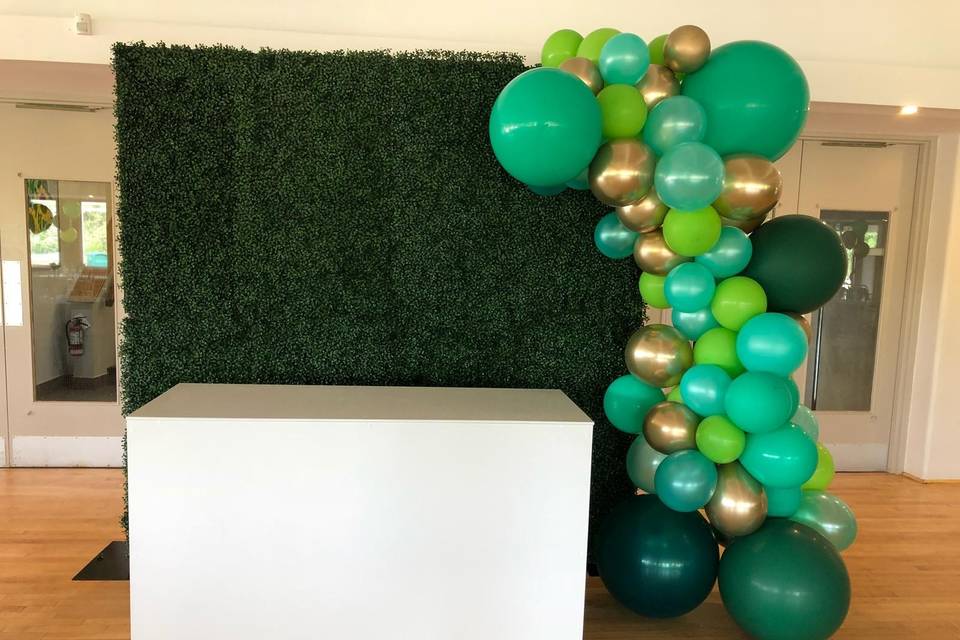 Dessert table with green balloons