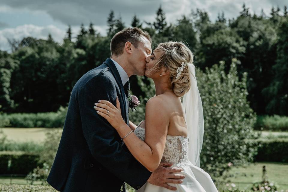 Bride and groom kiss