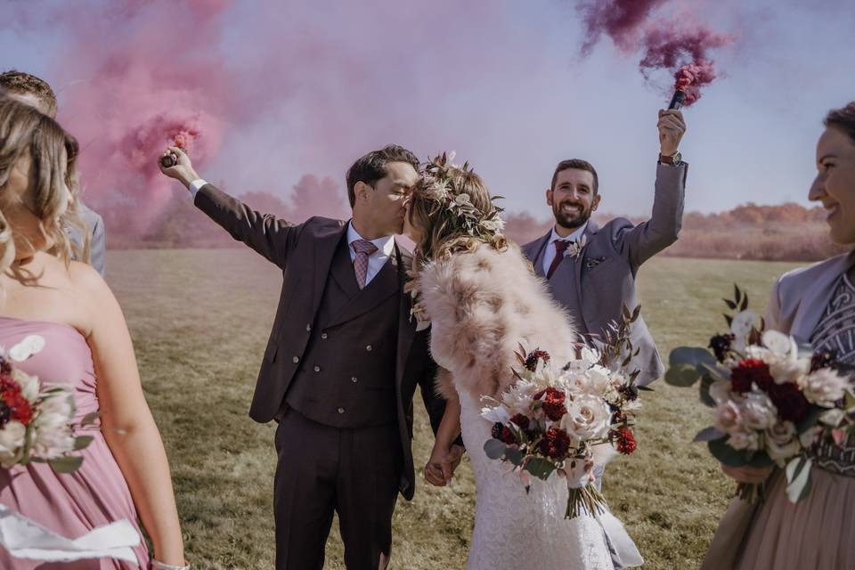 Bride and groom smoke bombs